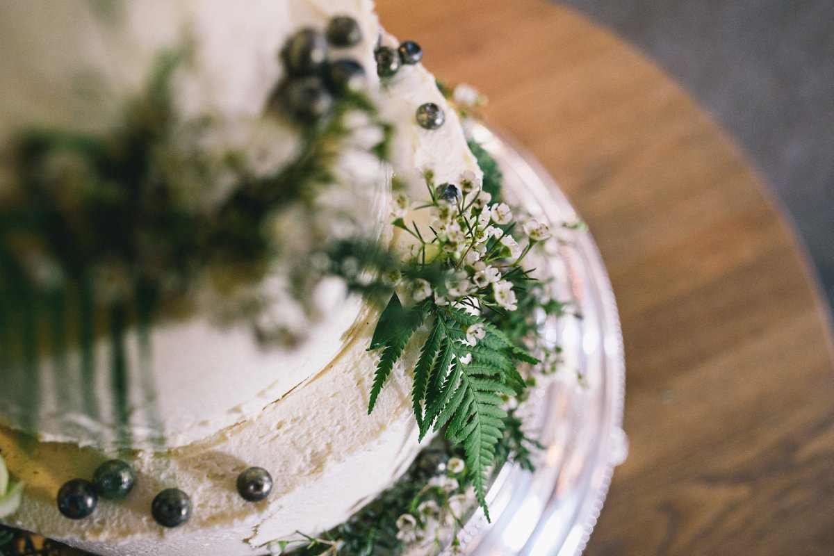 The wedding cake was a woodland inspired one, with greenery and fresh berries