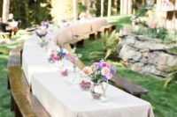 09 backyard tables with colorful flower centerpieces and benches