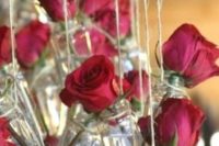 09 hanging jars with red roses over the reception