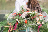 10 The newlyweds also went in a boat decorated with evergreens and lush florals in holiday colors