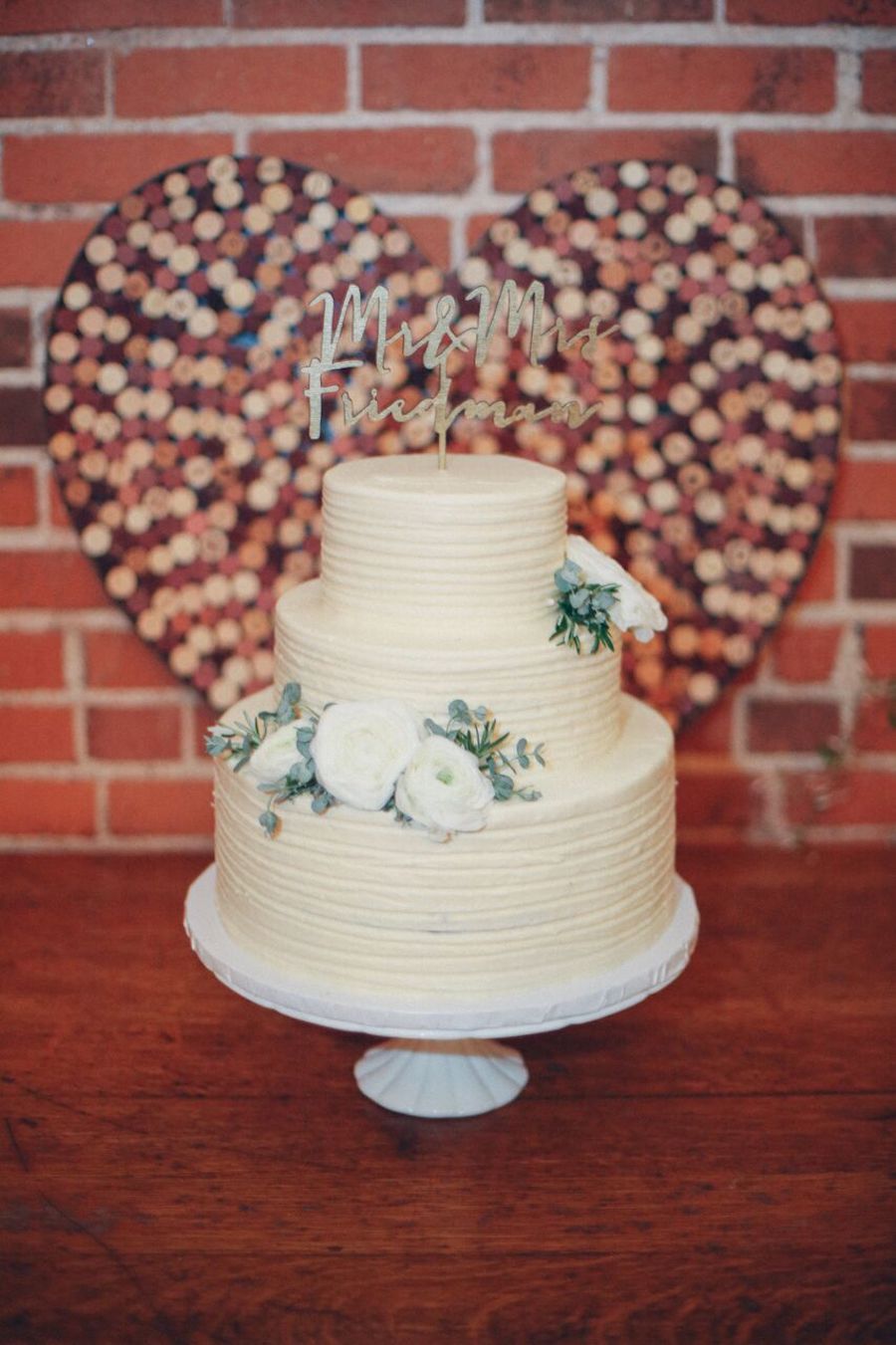 The wedding cake was a simple ivory one with fresh flowers and a calligraphy topper