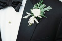 11 black tuxedo with a fresh greenery boutonniere