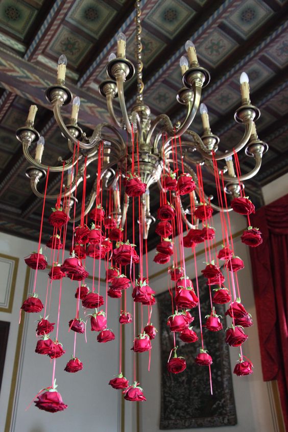 flowers cascading from hanging light or chandelier