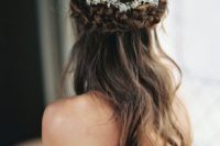 11 half up hairstyle with a thick braid and a floral crown