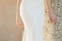 11 spaghetti strap wedding dress with a V-neck and an embellished belt by Martina Liana