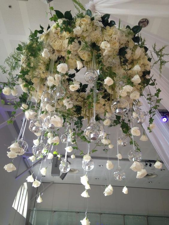 white roses chandelier with hanging candle holders