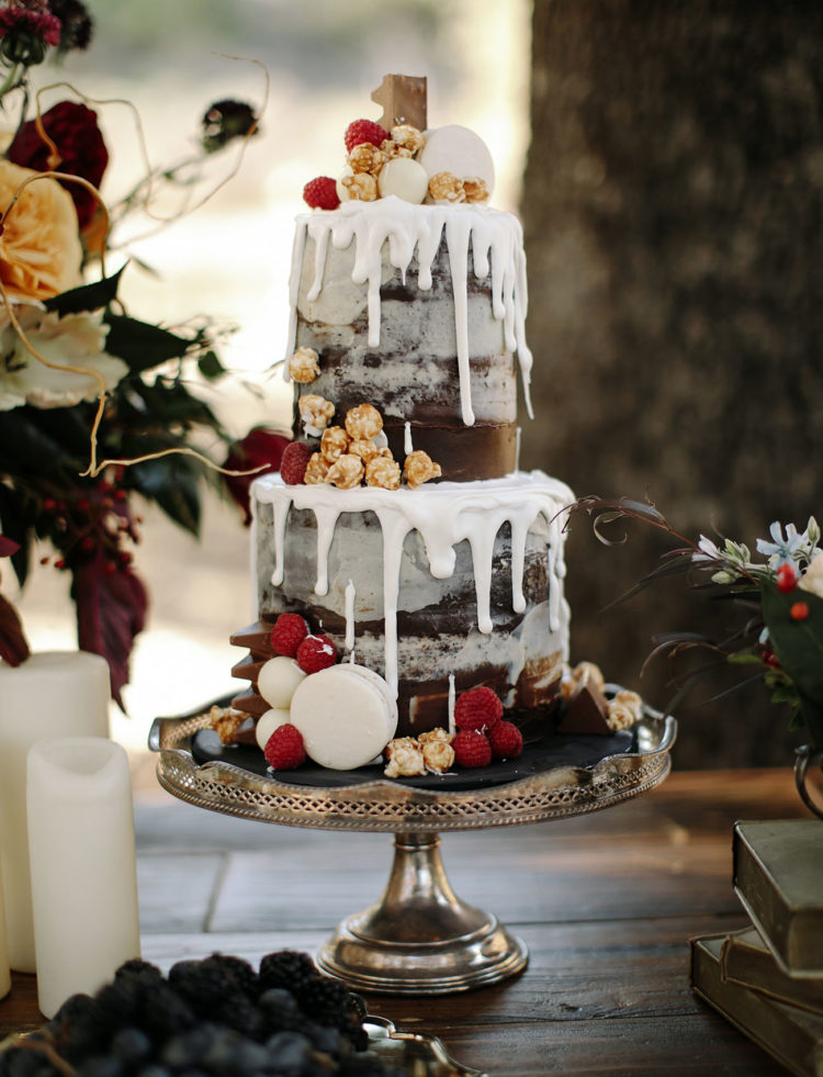 This chocolate semi naked cake with raspberries just wows