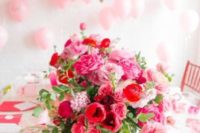 13 bold red and pink floral centerpiece looks very eye-catchy