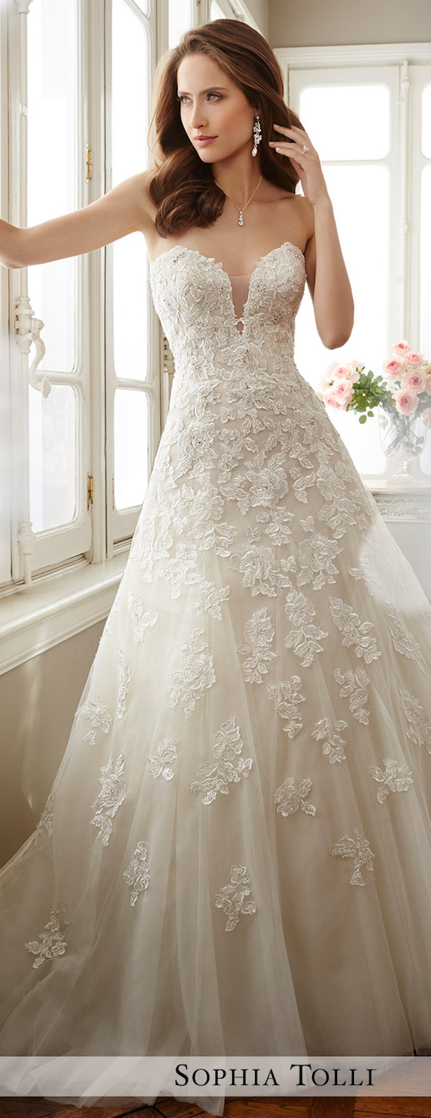 13 ivory lace and beading wedding dress will keep you covered on the neckline