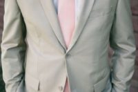 13 light grey suit with a light pink tie and boutonniere