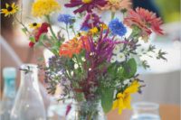 15 colorful wildflower centerpiece is perfect for a backyard or rustic wedding