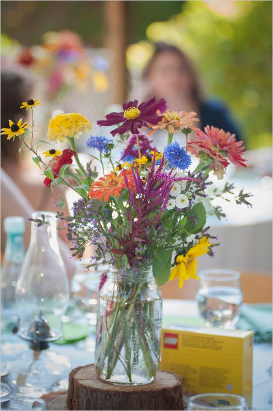 colorful wildflower centerpiece is perfect for a backyard or rustic wedding