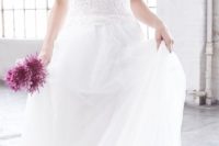 16 sheer lace wedding dress with a flowy skirt by Madison James