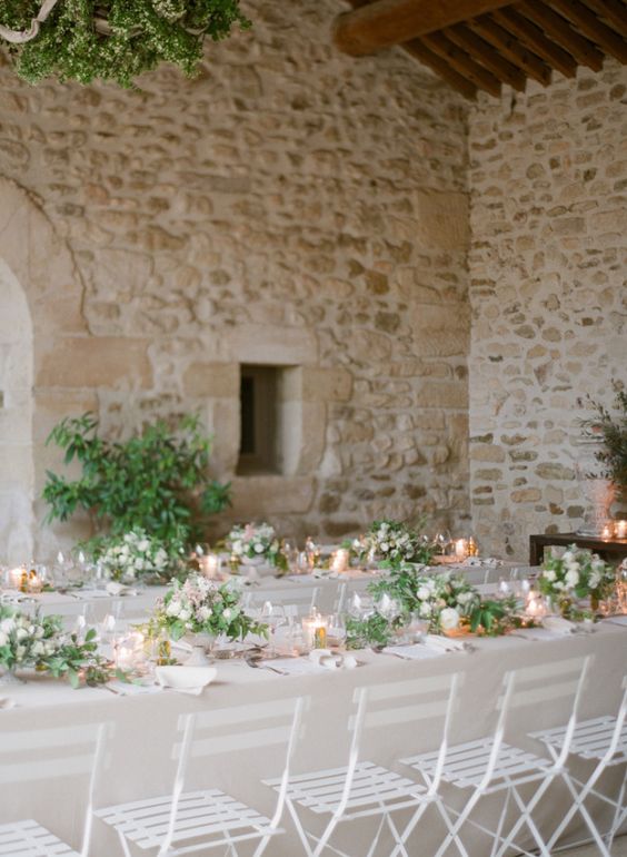 organic table decor with greenery and white flowers