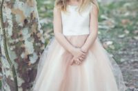 18 white plain bodice and a nude-colored layered tulle skirt