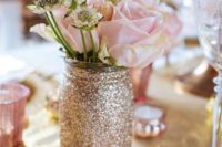 19 glittery gold mason jar with flowers as a centerpiece