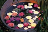 20 a galvanized bathtub with floating candles and flowers