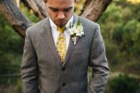 20 light brown suit, a white shirt and a yellow tie