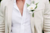 21 cream suit, white shirt and an orchid boutonniere