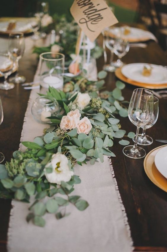 messy eucalyptus and blush roses table garland
