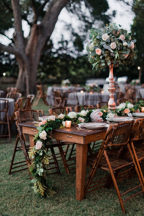 chic blush rose pomanders and table runners echo with each other