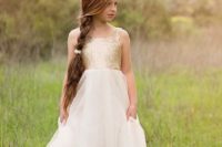 23 a gold sequin bodice and a flowy ivory skirt
