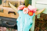 23 colorful skulls with flowers are a great idea to decorate a boho wedding
