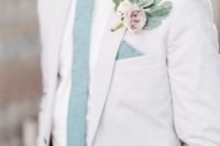23 crispy white suit, shirt, a mint blue tie and a pale boutonniere