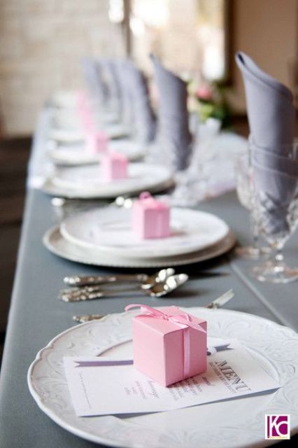 grey tablecloth and napkins, pink gift boxes
