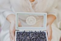 24 creative way to display the wedding bands, in a box filled with lavender