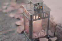 24 galvanized lantern with a candle and pink petals