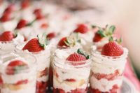 25 mason jars with strawberries and whipped cream