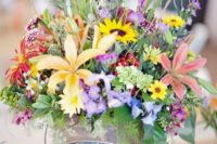 26 wildflower wedding centerpiece in a paint bucket