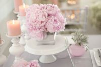 27 grey fabrics and pink florals and candles for the table decor