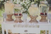 27 rustic wedding drink bar with baskets and straws