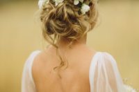28 messy wavy updo with fresh white flowers