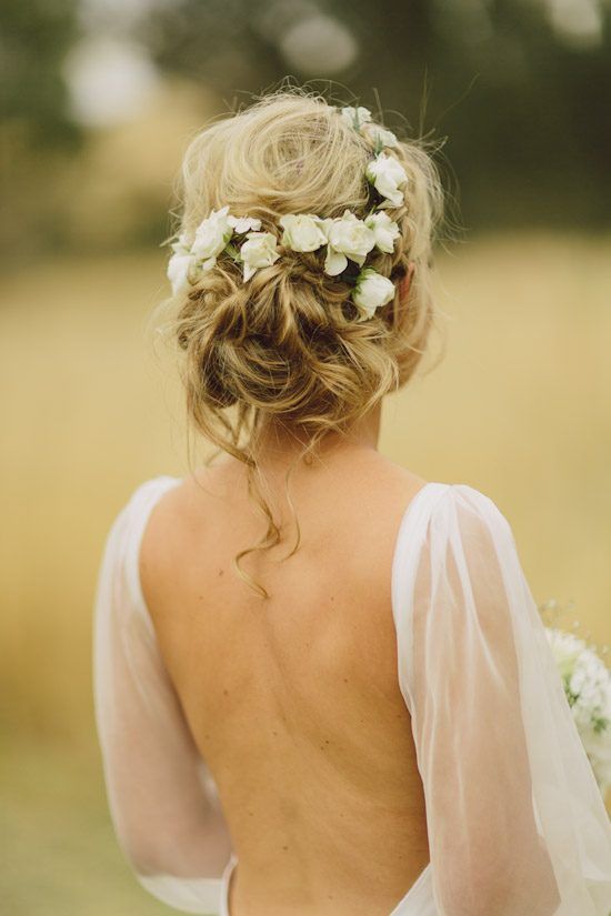 messy wavy updo with fresh white flowers