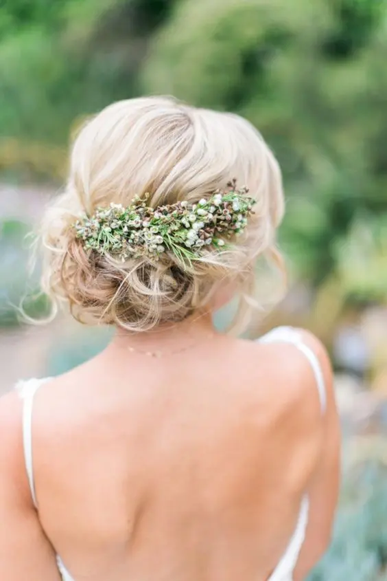 messy updo with fresh flowers
