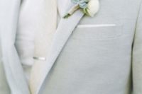 30 light grey suit with a cream tie and shirt, a succulent boutonniere