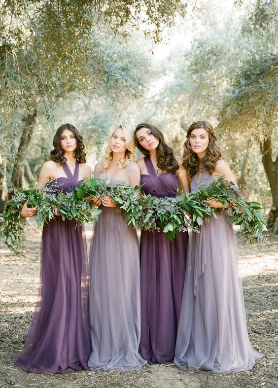 purple one shoulder dresses and grey lavender bridesmaids' gowns