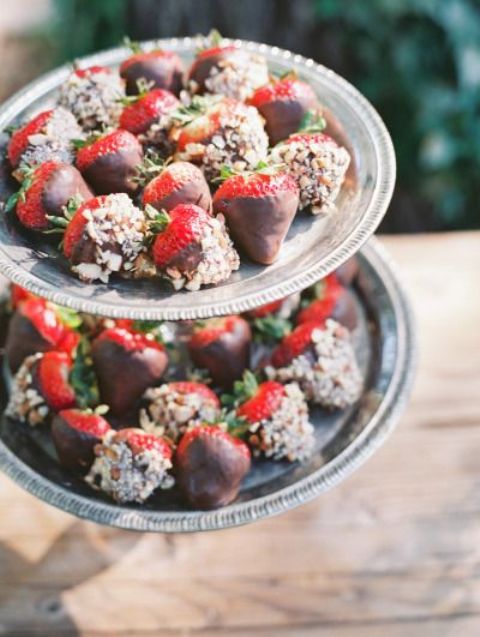 strawberries covered with chocolate and nuts