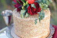33 gold wedding cake topped with red flowers