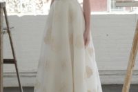 33 plunging neckline gown with gold floral details by Lela Rose