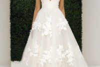 35 wide strap deep plunging neckline wedding dress with a floral applique skirt