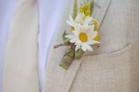 36 tan suit and tie, a yellow and white flower boutonniere