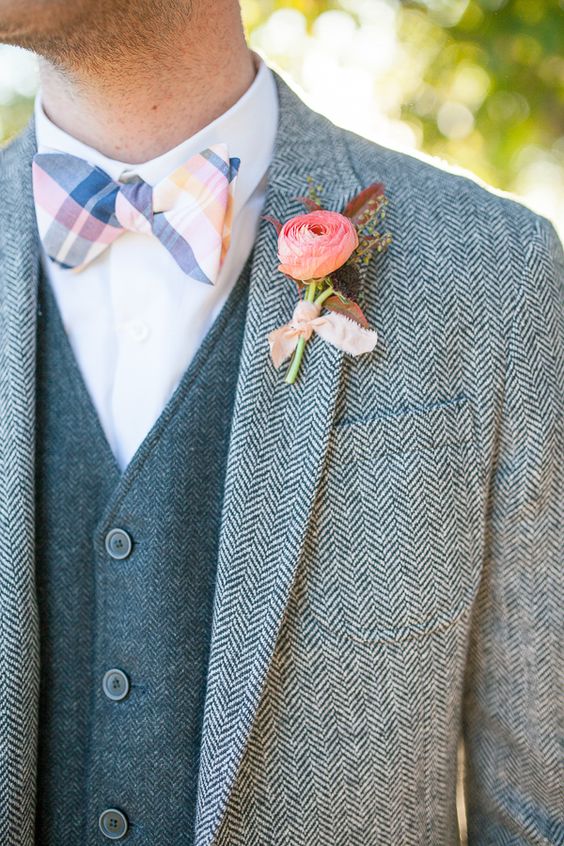 tweed suit with a vest, a striped colorful bow tie