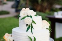 39 white wedding cake with white flowers and greenery