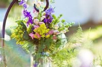 41 colorful wildflowers in a jar for decorating the aisle