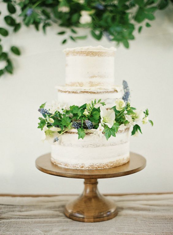 semi naked wedding cake with fresh flowers and greenery