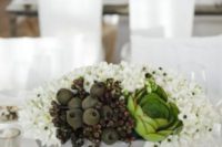04 concrete bowl with various flowers and fruit as a wedding centerpiece